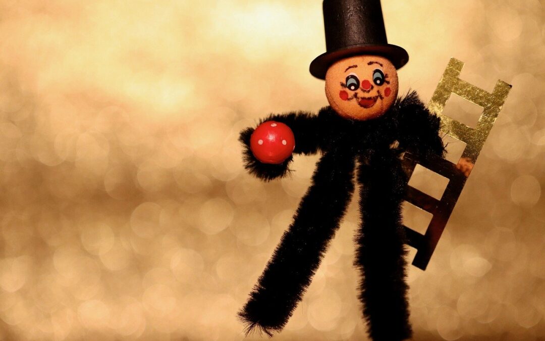 Idzie kominiarz po drabinie